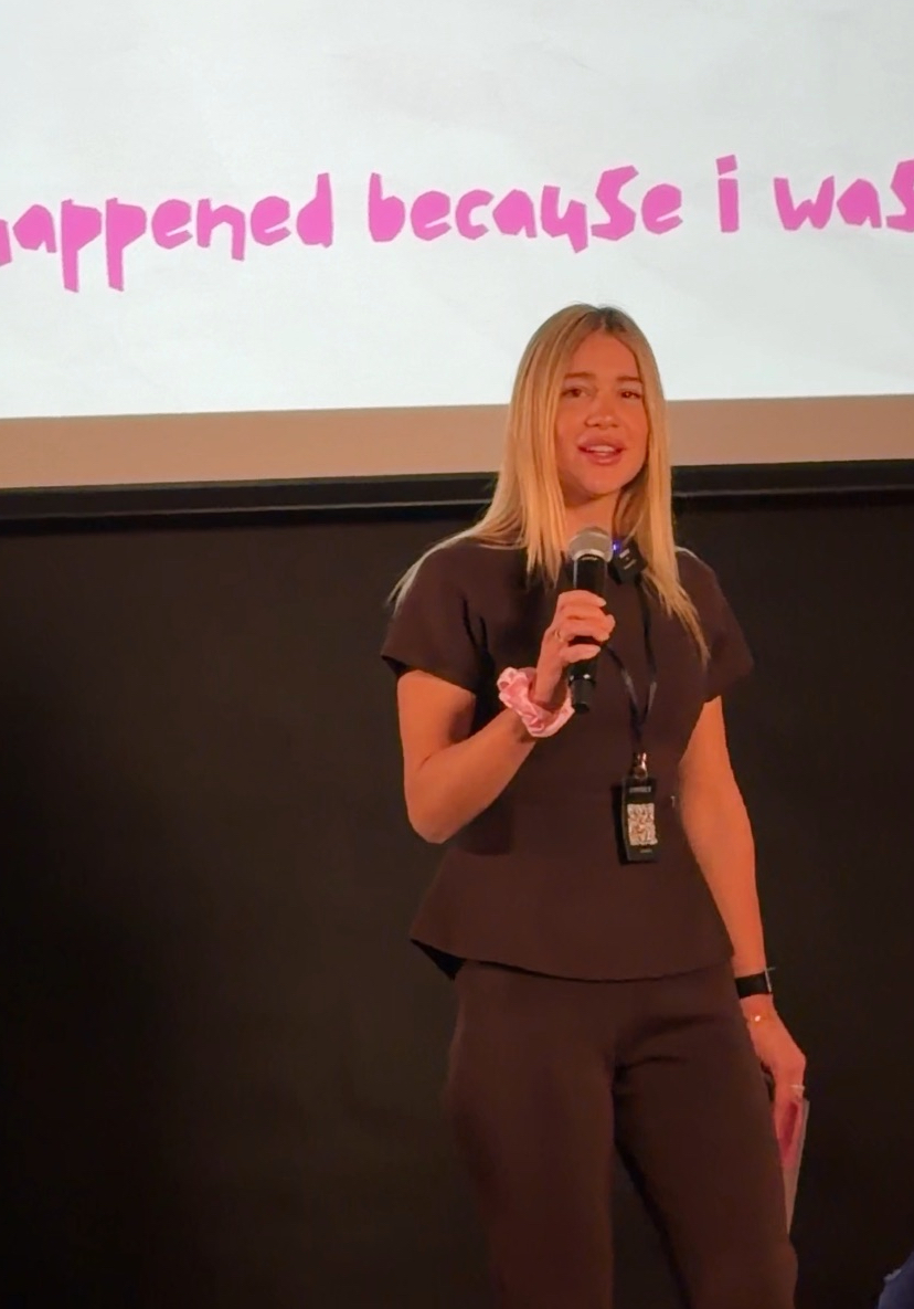 Mariam Gogidze holding a microphone during a talk in London