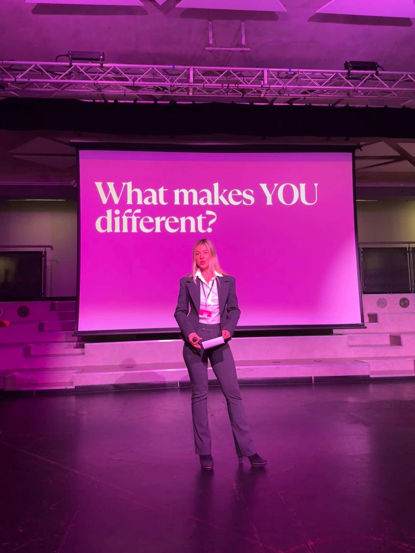 Mariam Gogidze on stage asking 'What makes YOU different?'